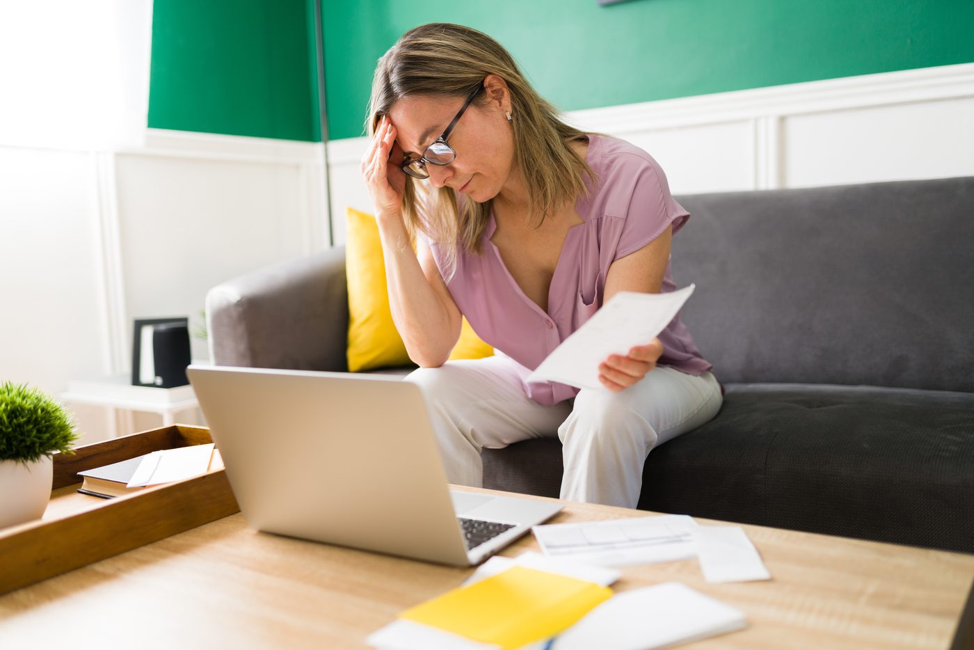 Woman stressed reviewing medical bills